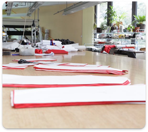Ready-cut Fabric Panels spread out on large production table at Mode Agency Mirage, Vratsa, Bulgaria.