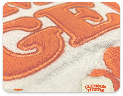 Close-up personalised Applique application on University sweater